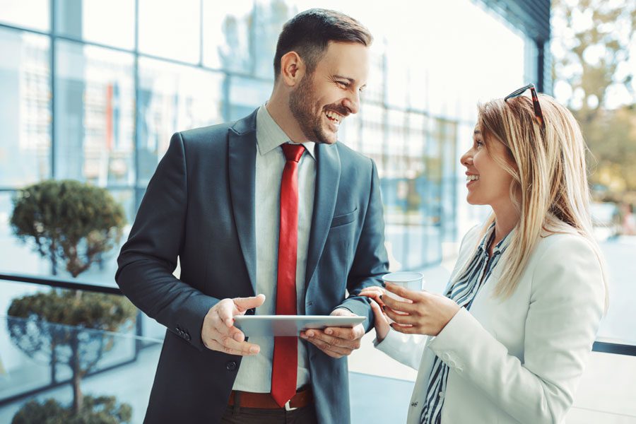 Review Our Agency - Business Associates Talking Over Coffee